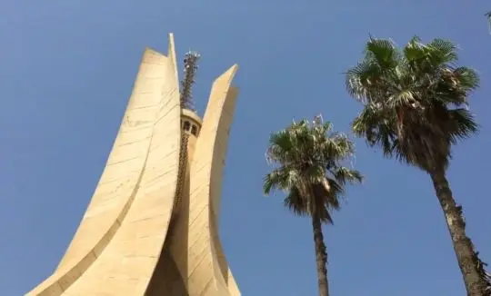 Martyrs' Memorial and two palm trees